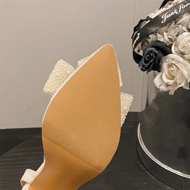 Liyke Fashion Design White Pearl Bowknot Women Pumps Sexy Pointed Toe High Heels Wedding Prom Shoe PVC Transparent Sandal Female